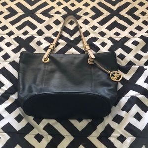 A big Michael Kors bag